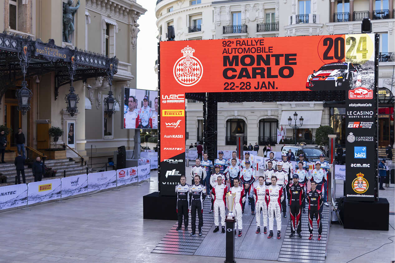 Drivers posing side by side at the Monte Carlo Square entry ceremony set