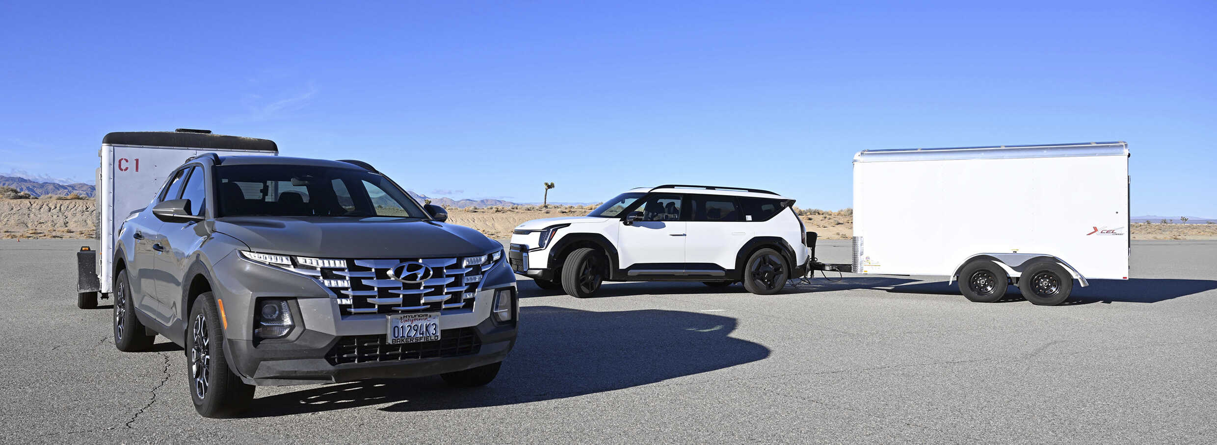 Tucson and EV9 pulling a trailer at the driving test site