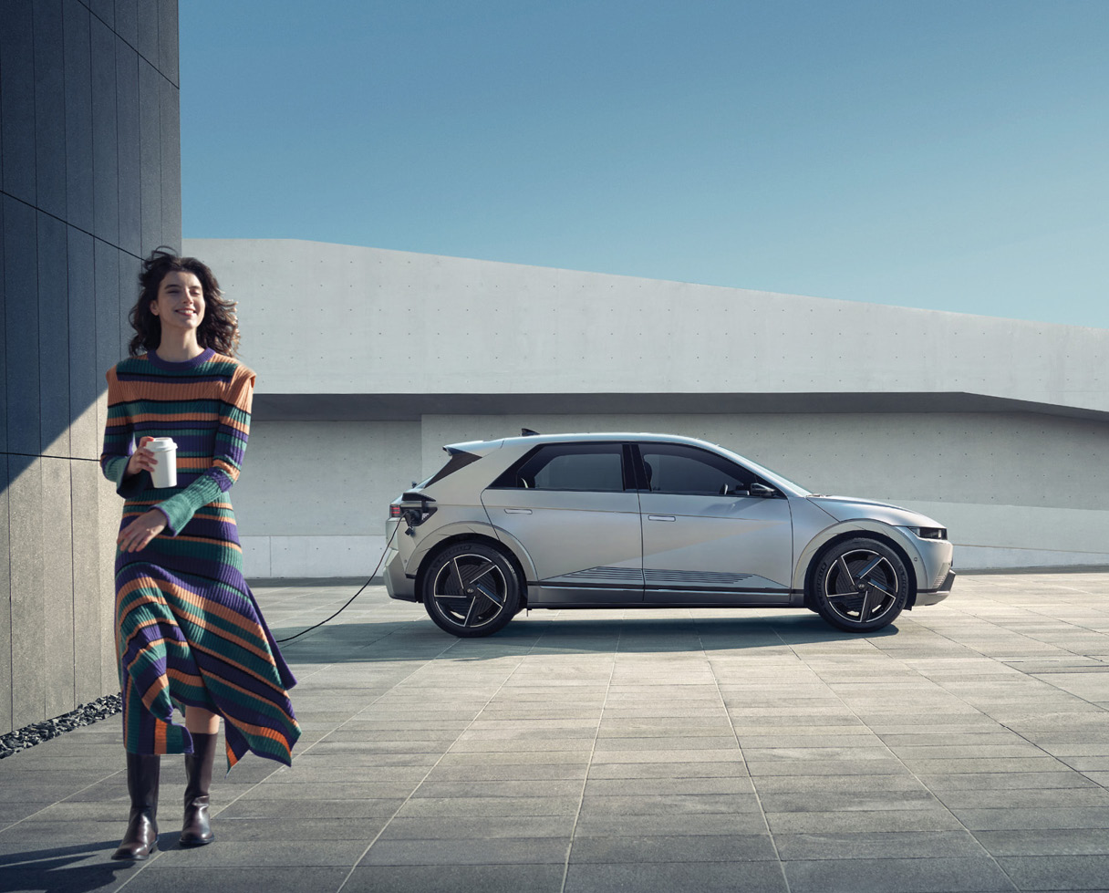 Ionic 5 and woman standing in front of beautiful architecture