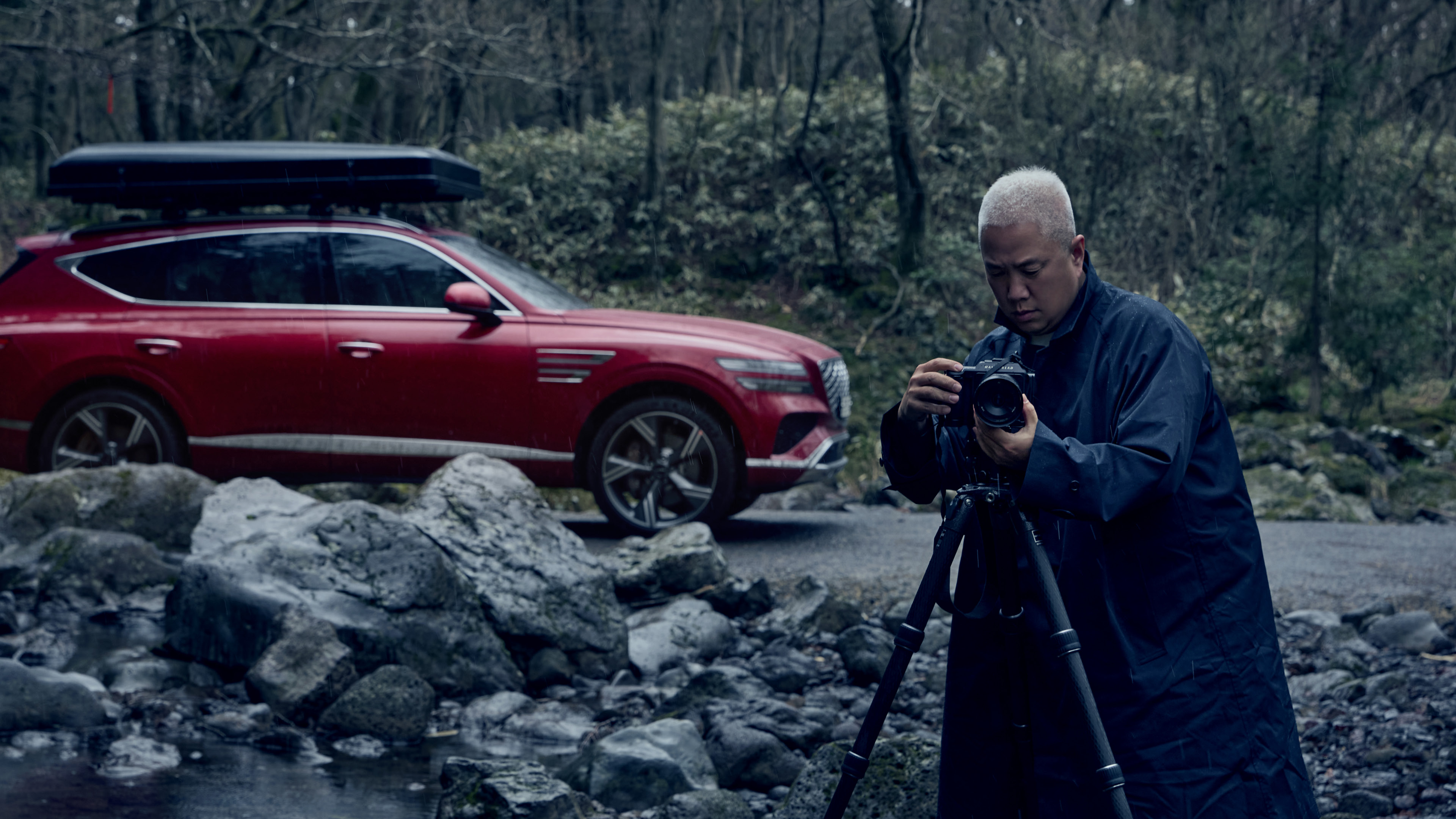 a photographer photographing a car