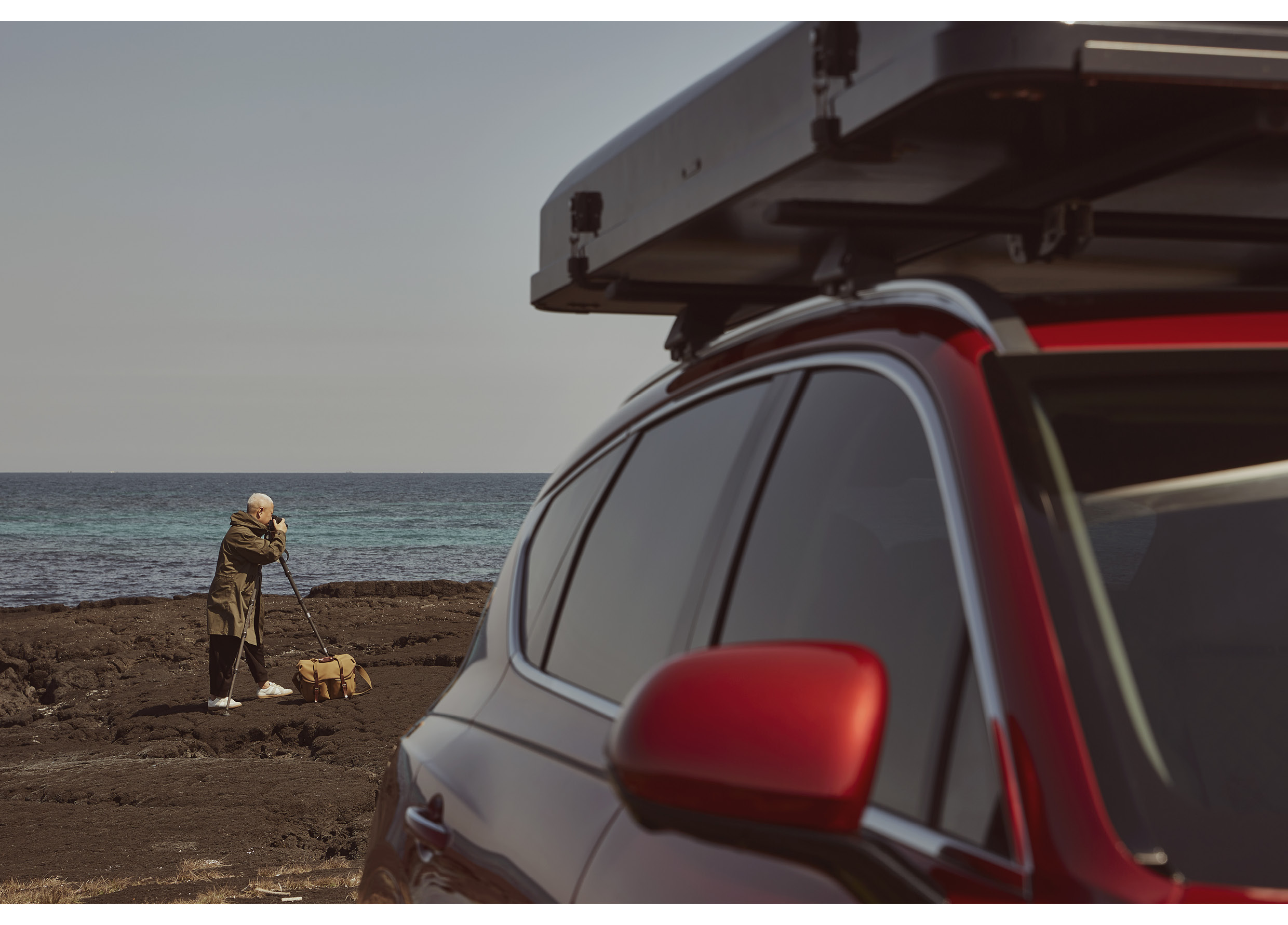 a photographer photographing a car