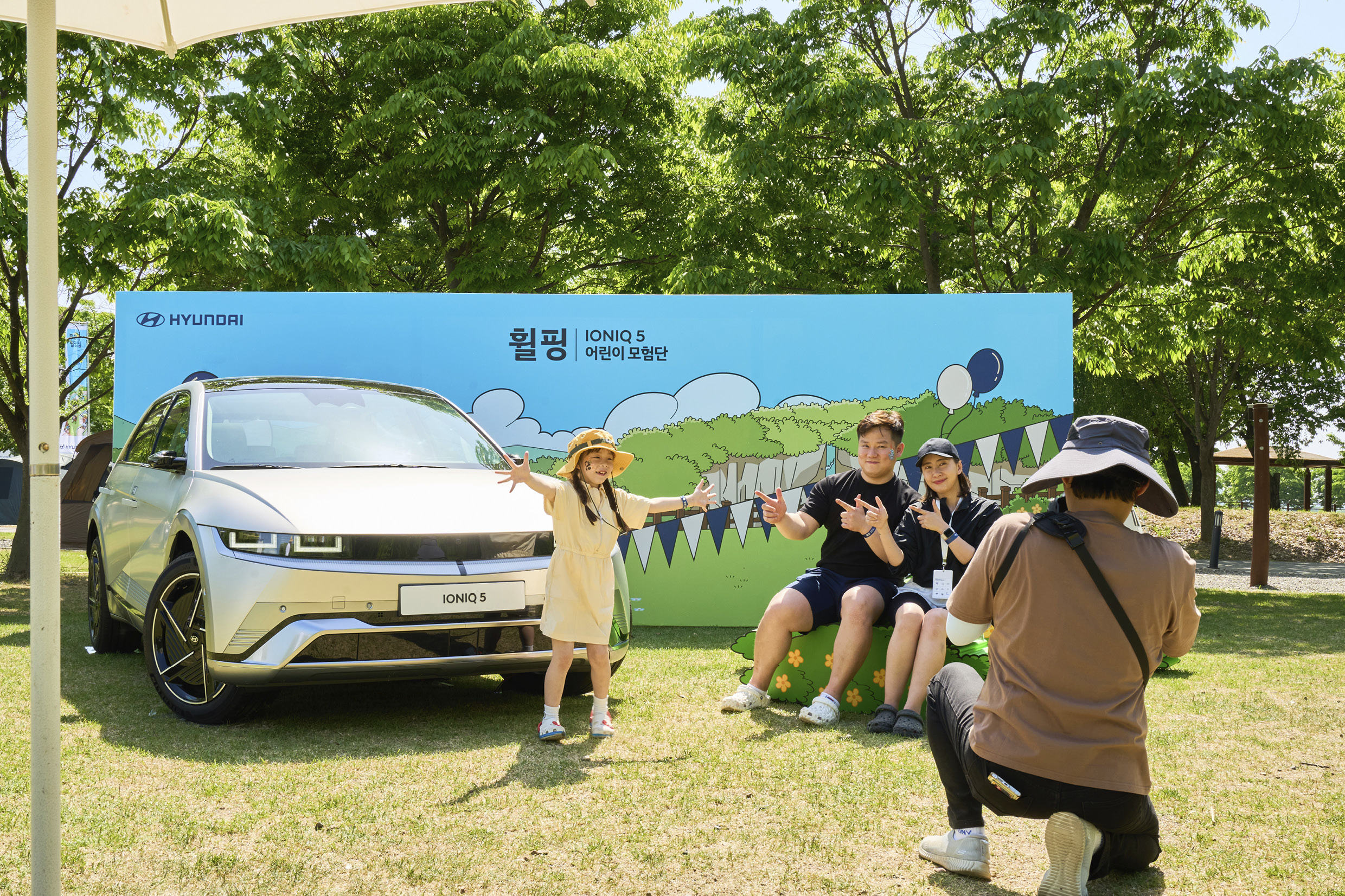 Family members taking pictures at the site of Hyundai Motor's wheeling event