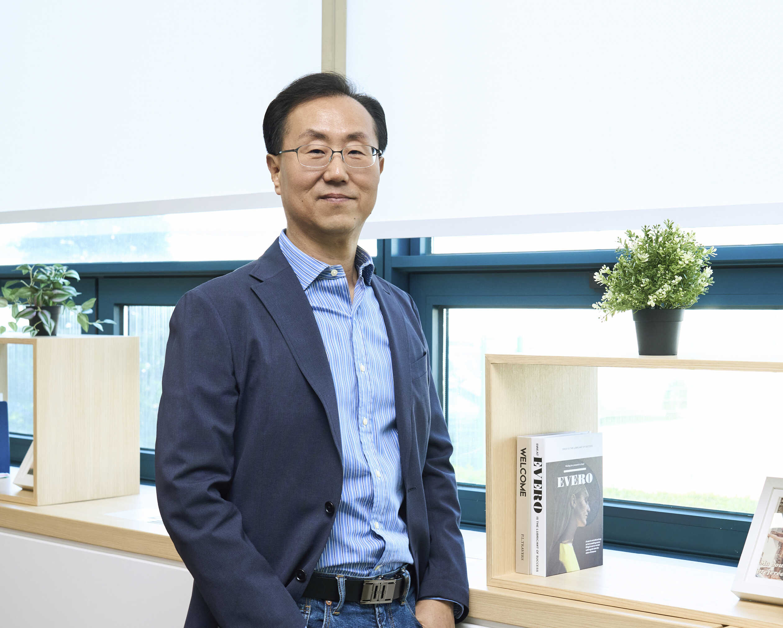 A tech developer standing with his hands in his pockets
