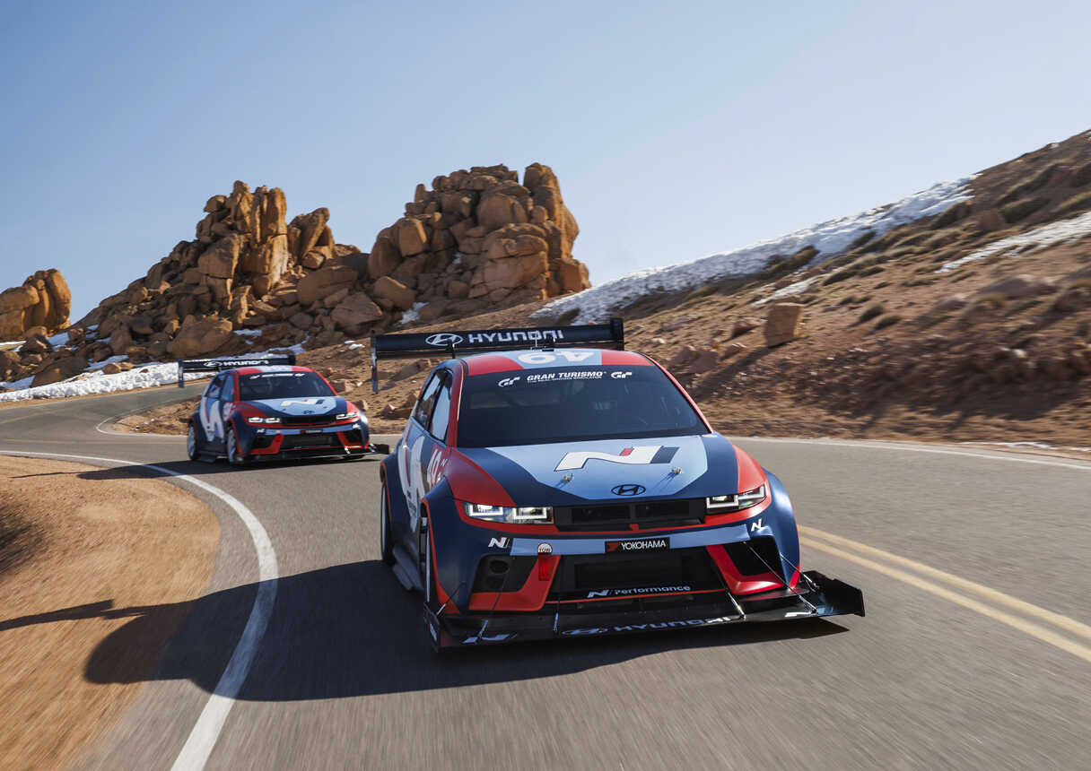 Front view of two Ioniq 5 N TAs driving the Pikes Peak International Hillclime course