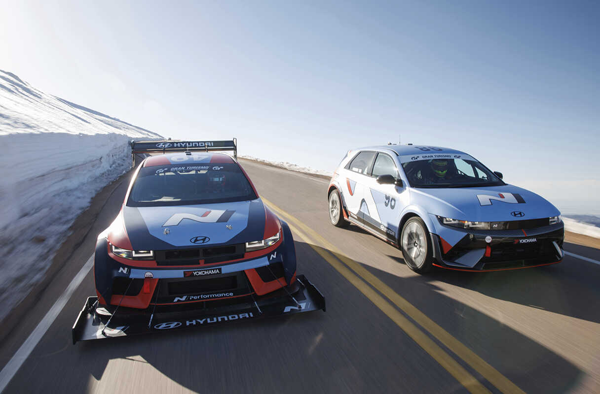 Two race cars running on the Pikes Peak Hill Climb course