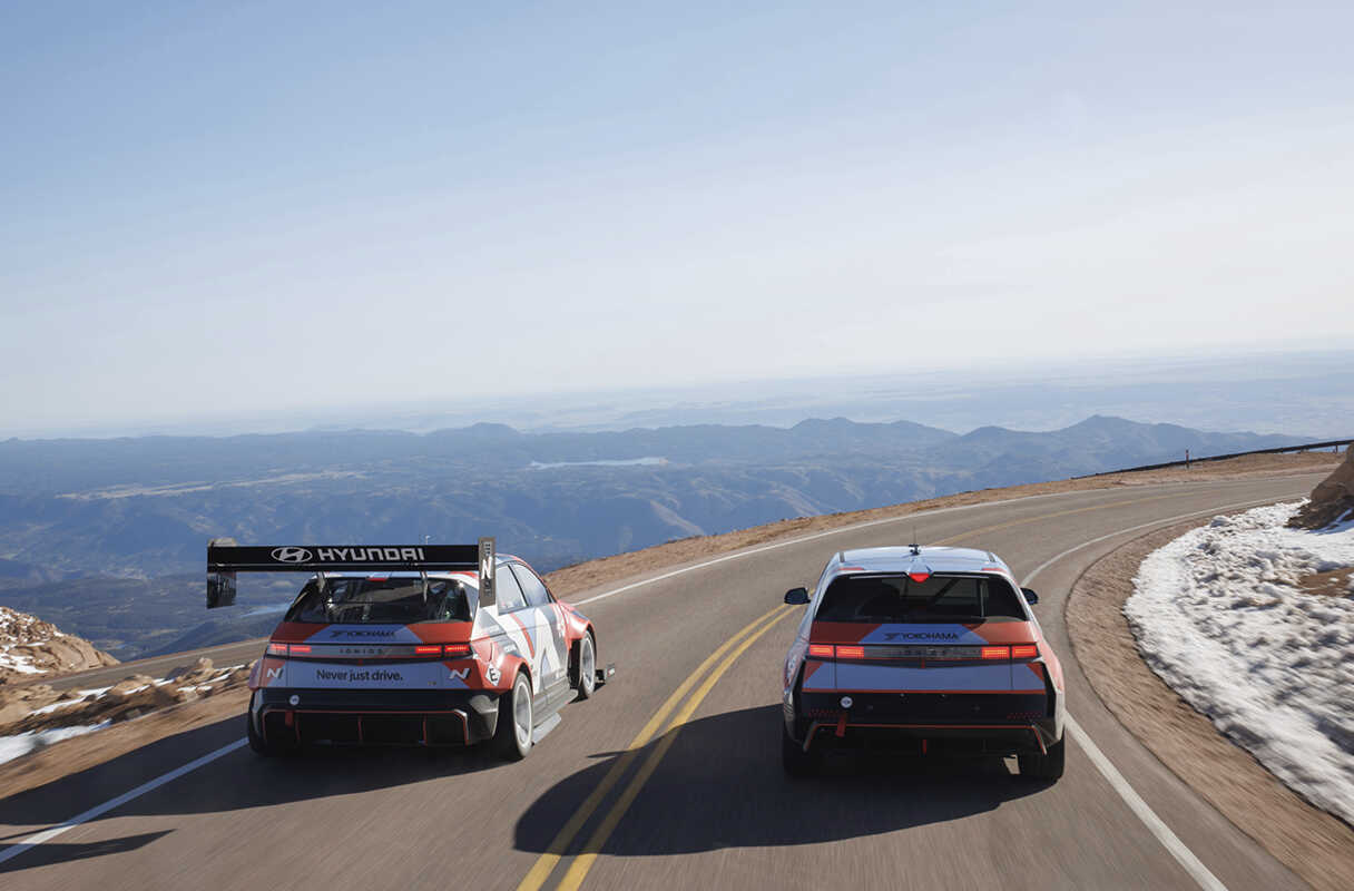 the rear of vehicles speeding along the Pikes Peak course