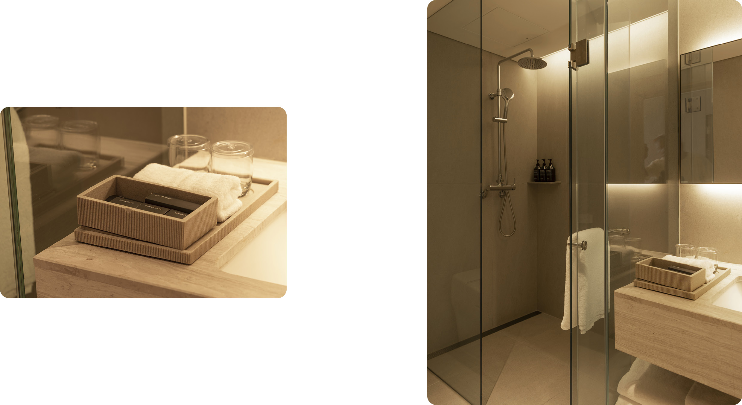 욕실 샤워룸과 세면대 옆 어메니티가 놓인 모습