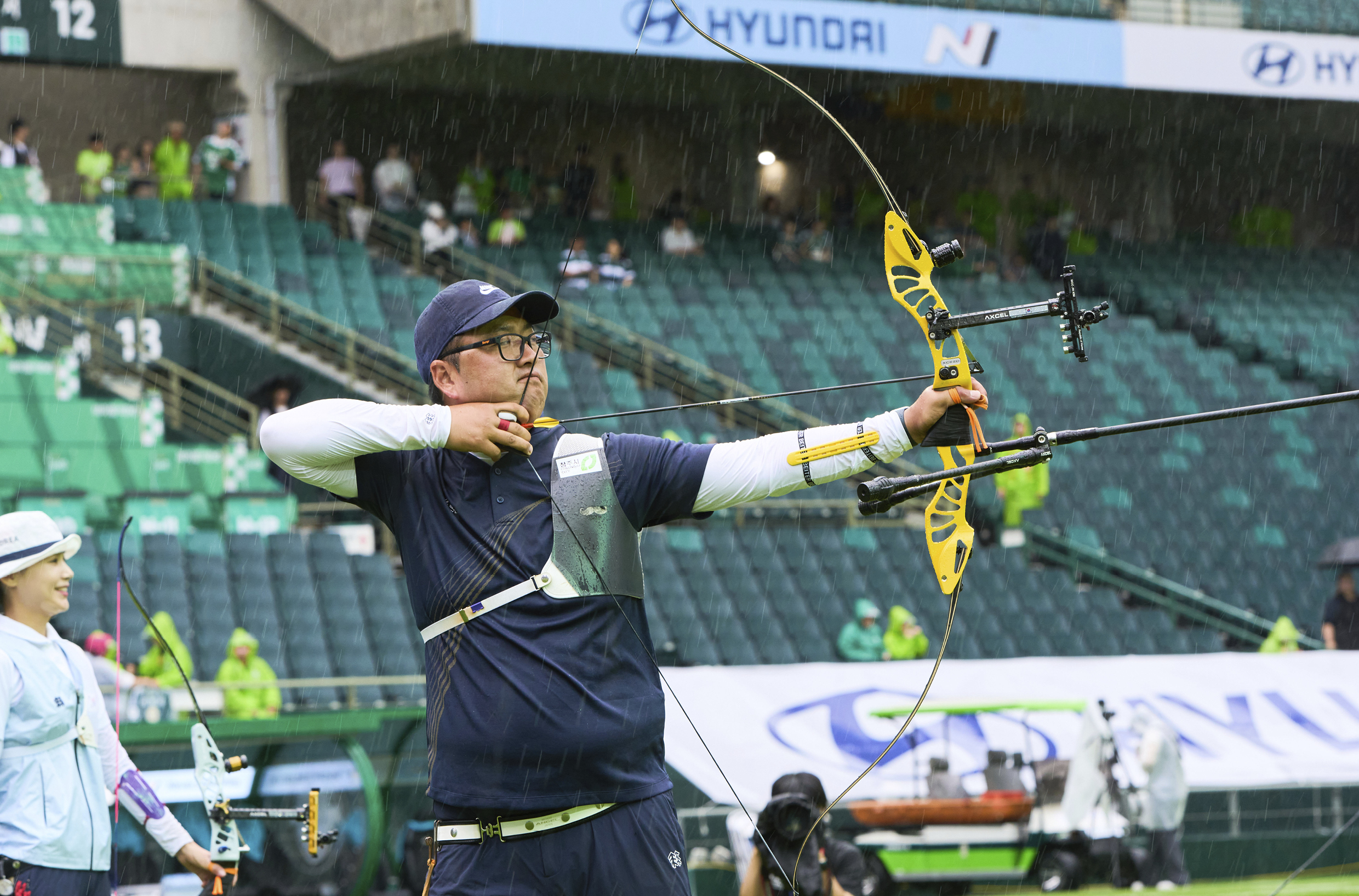 A male archer pulled a bowstring
