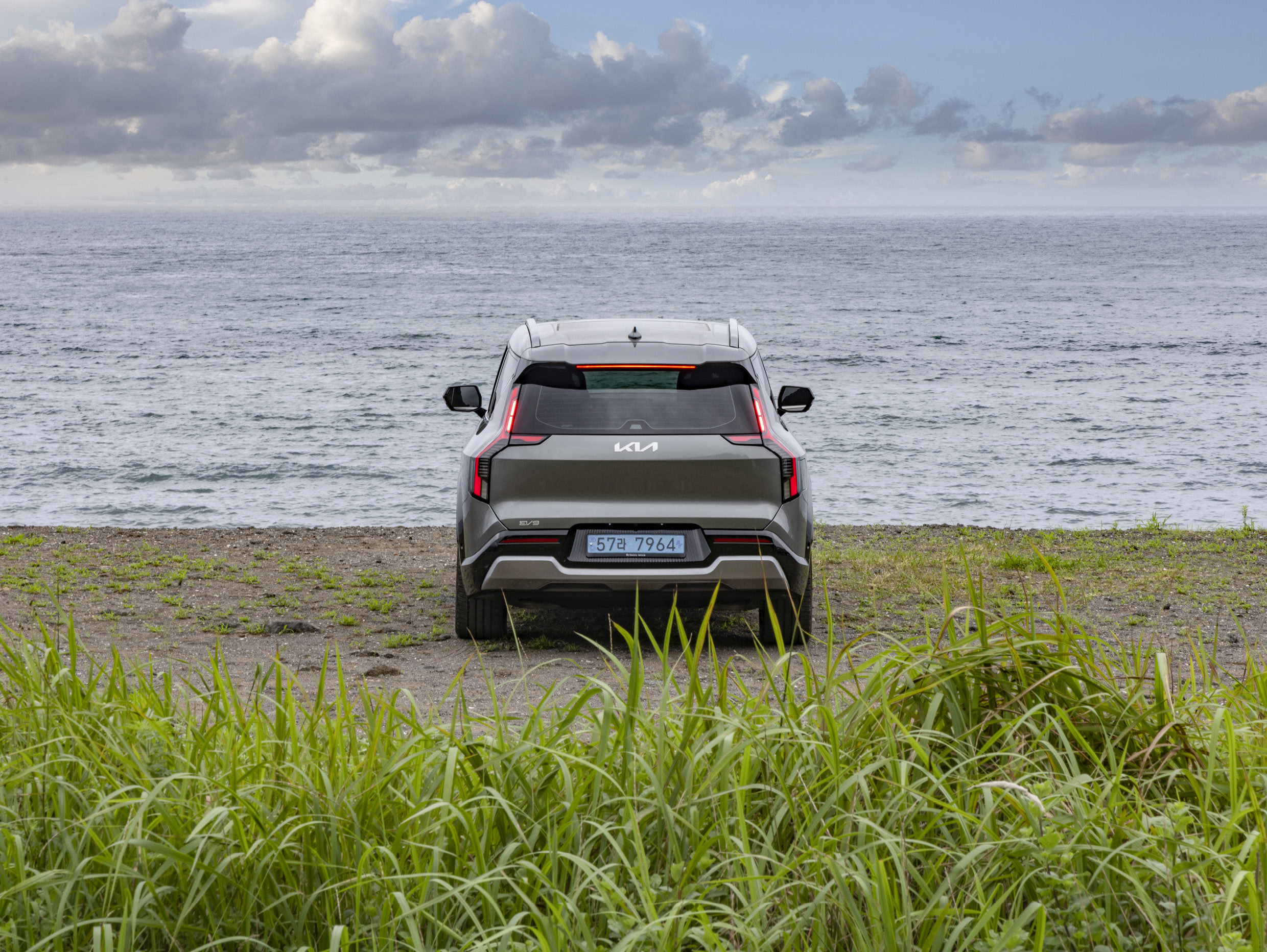 A grey SUV pulled up on the beach
