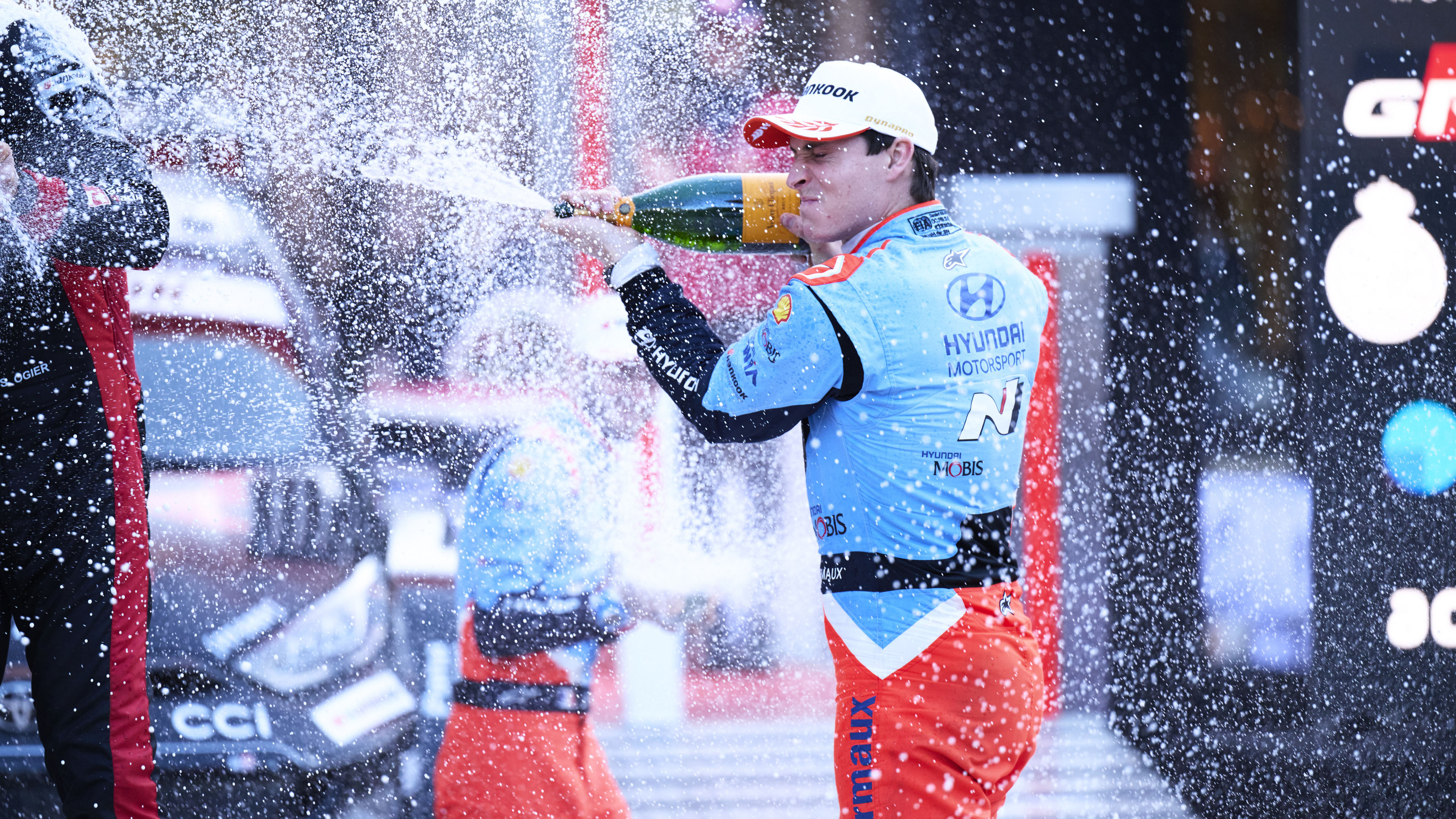 Hyundai's driver popping champagne
