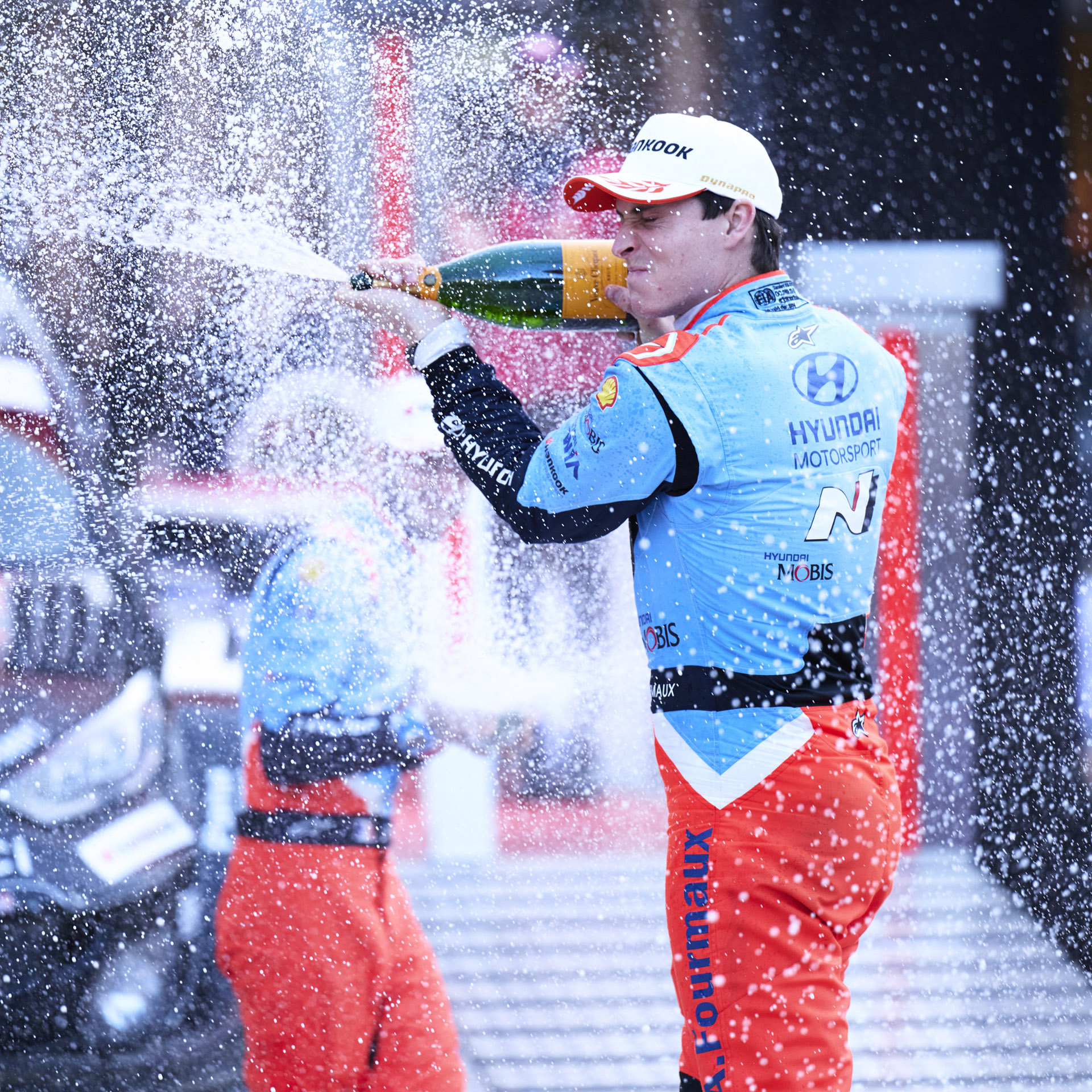 Hyundai's driver popping champagne