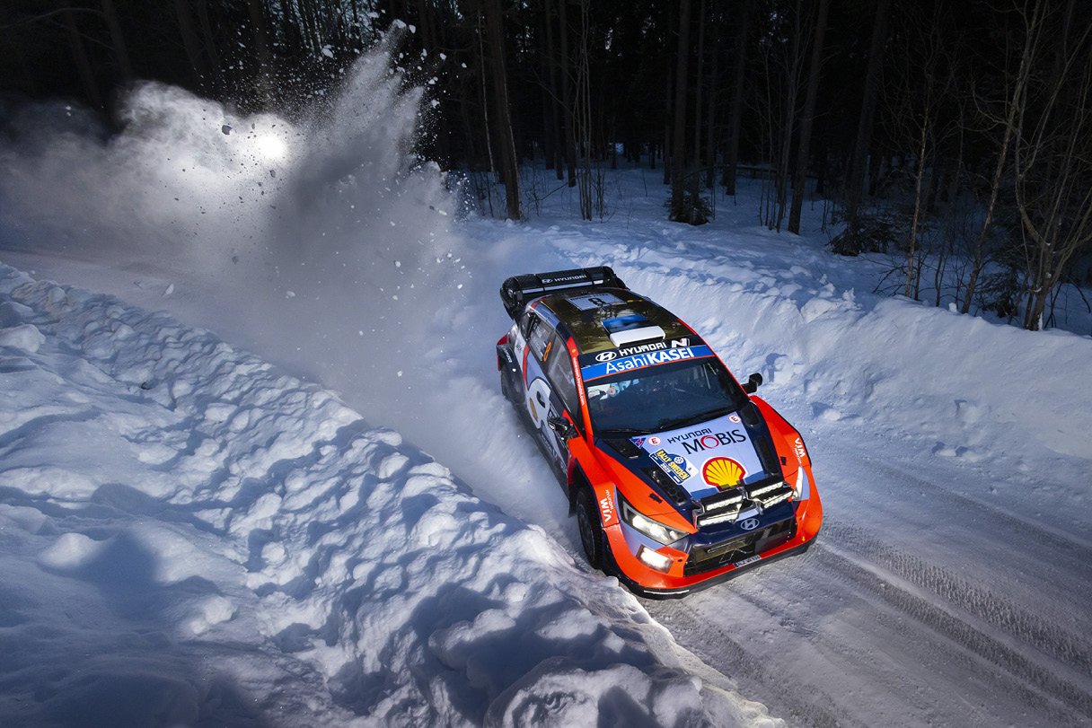 a rally car running through the snow