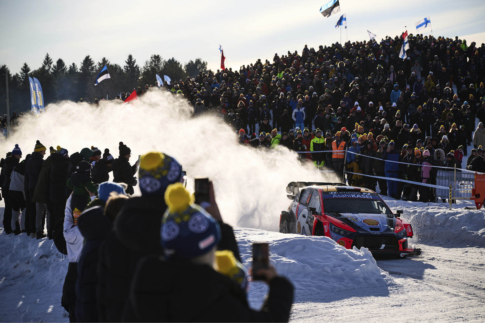 a rally car running through the snow