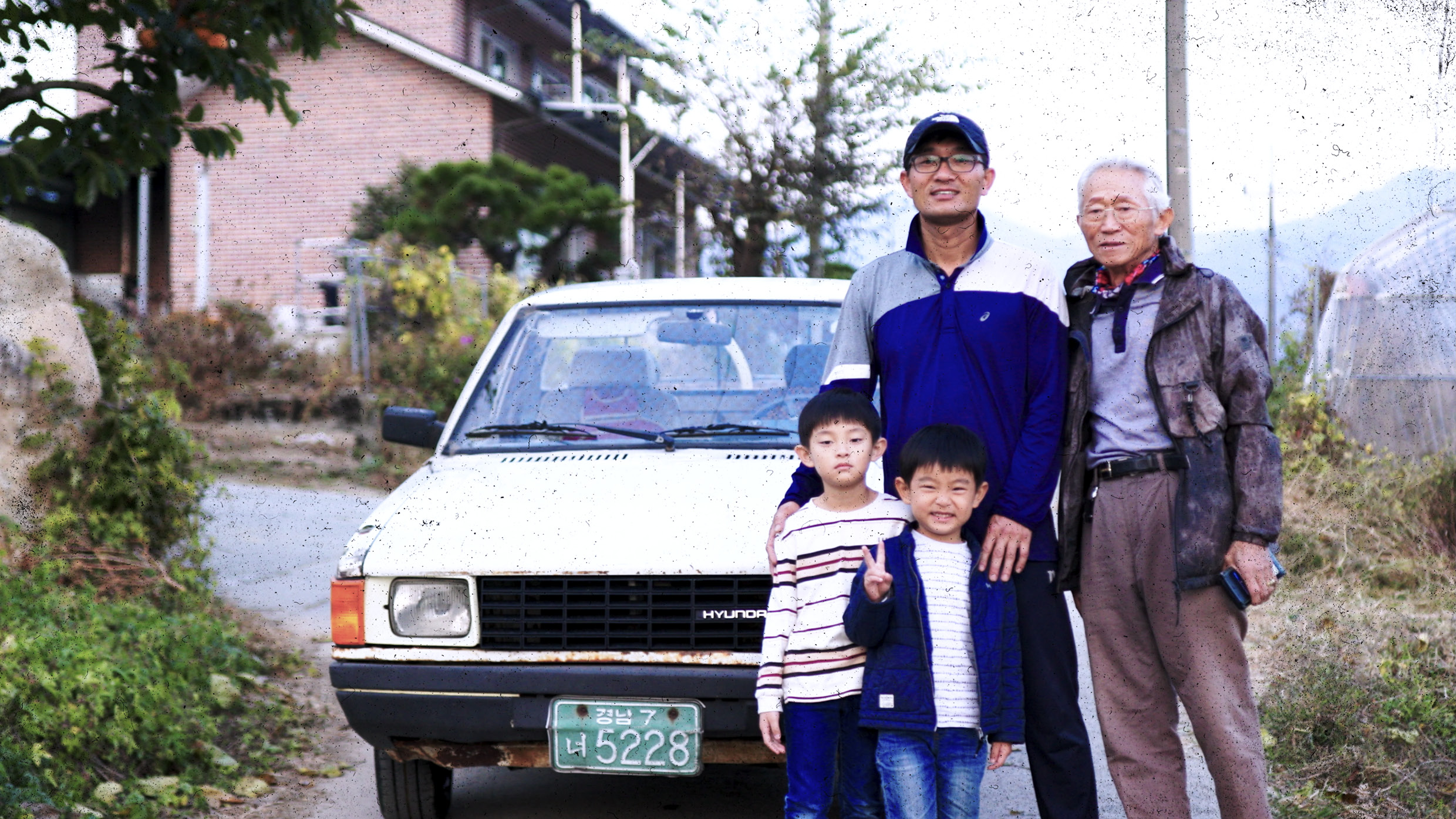 Pony and three generations of family standing together