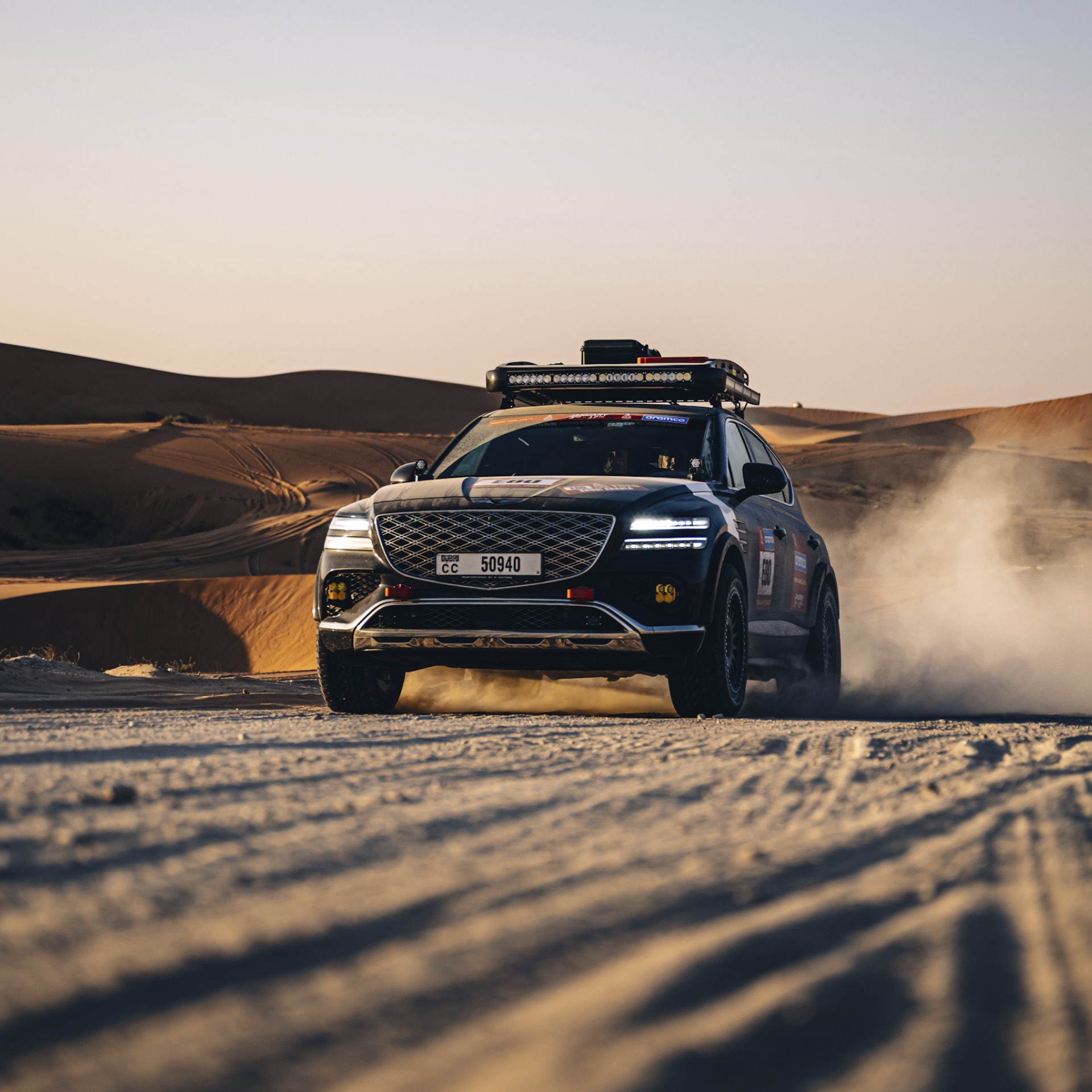 The image of GV80 racing through the desert