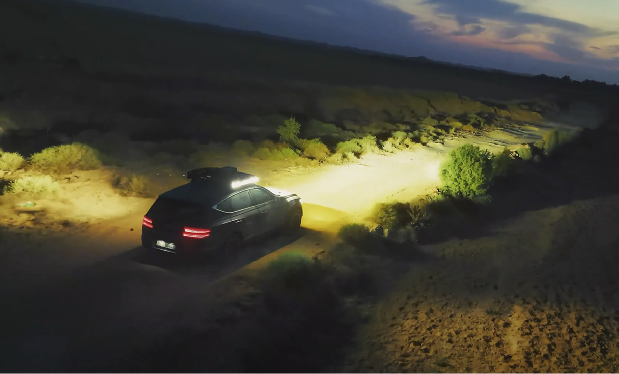 A view of GV80 driving at night in the desert