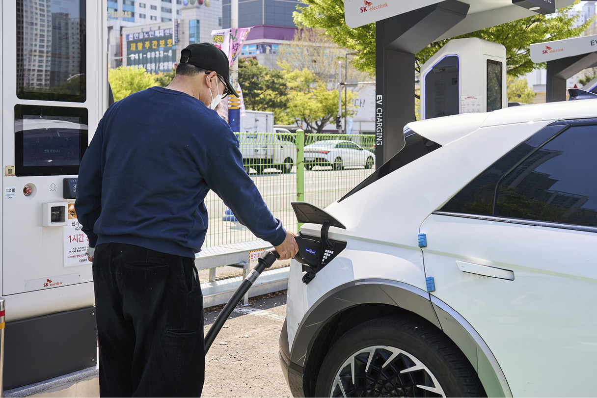 Electric cars charging at charging stations