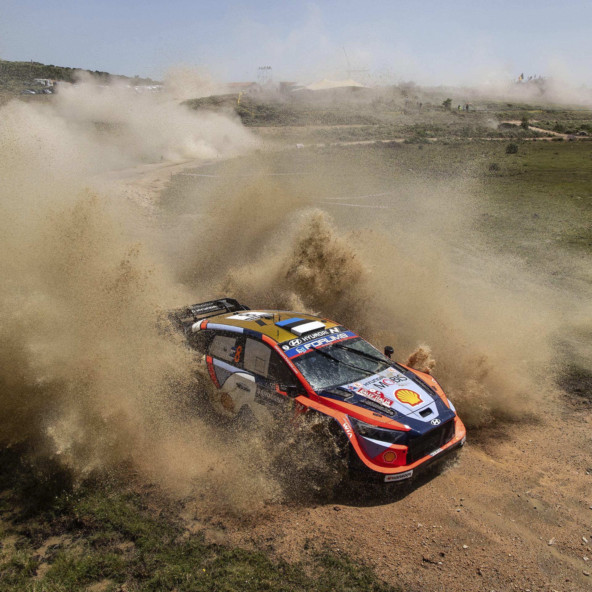 Hyundai team's rally car driving on unpaved roads