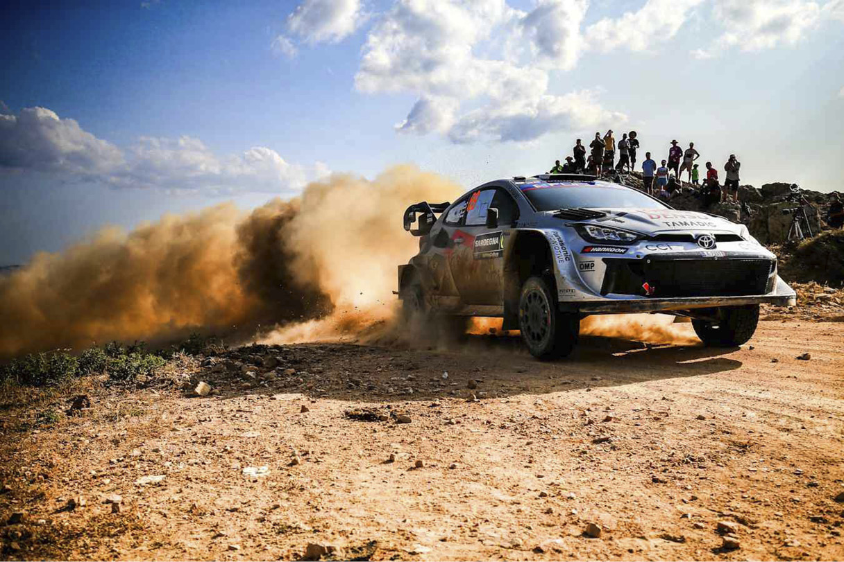 Toyota Rally Car Driving Down Unpaved Road