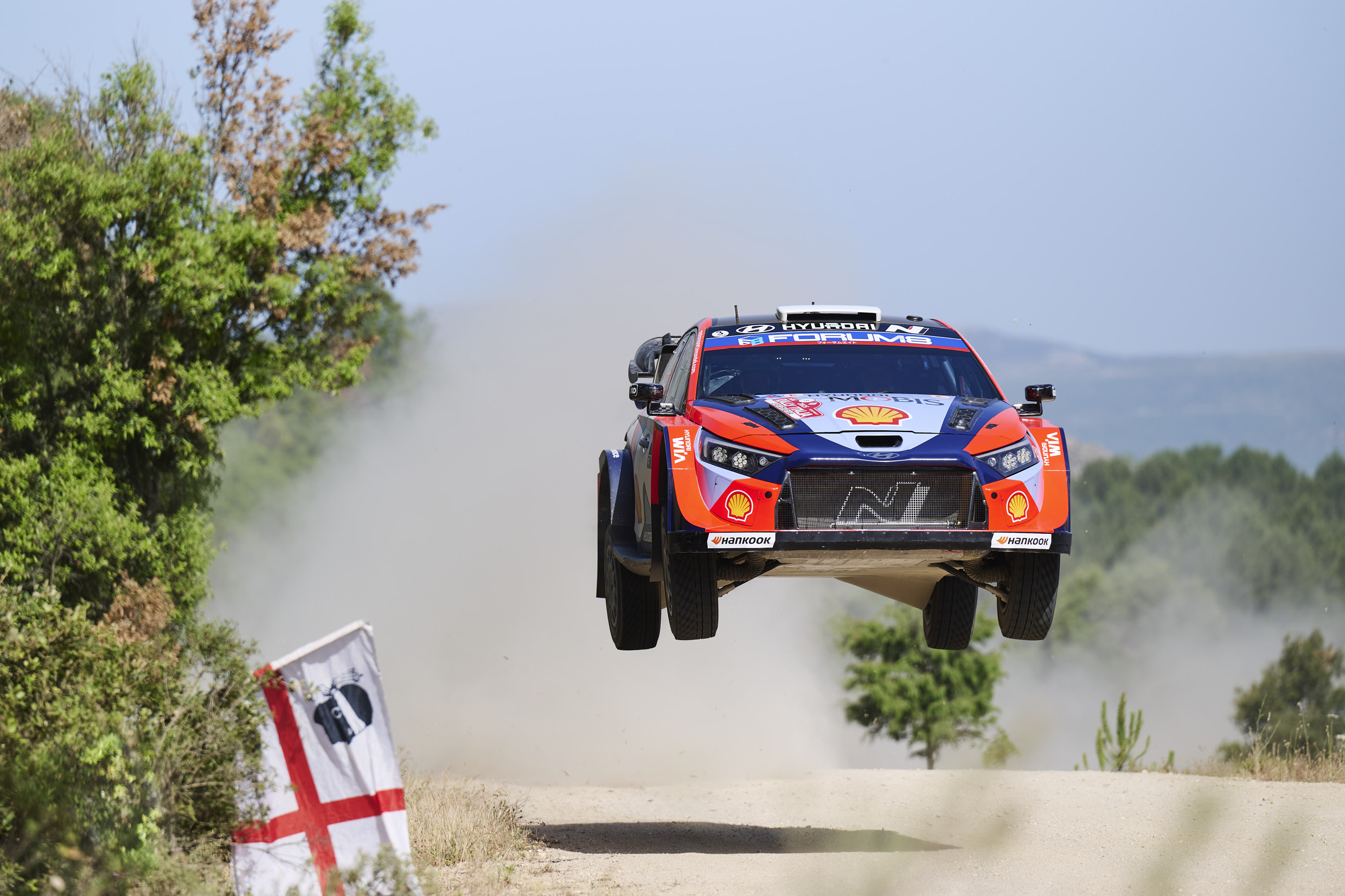 Hyundai team's rally car driving on unpaved roads