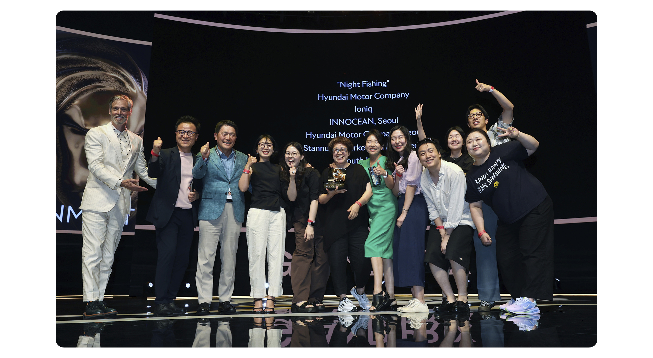 The crew of the movie “Night Fishing” taking pictures at the Cannes Lions International Festival of Creativity awards ceremony