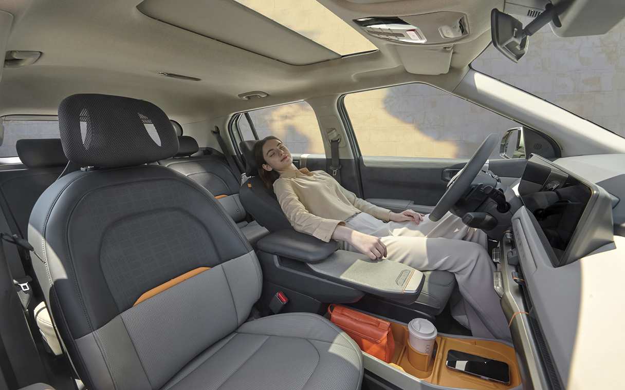 a driver resting in a car