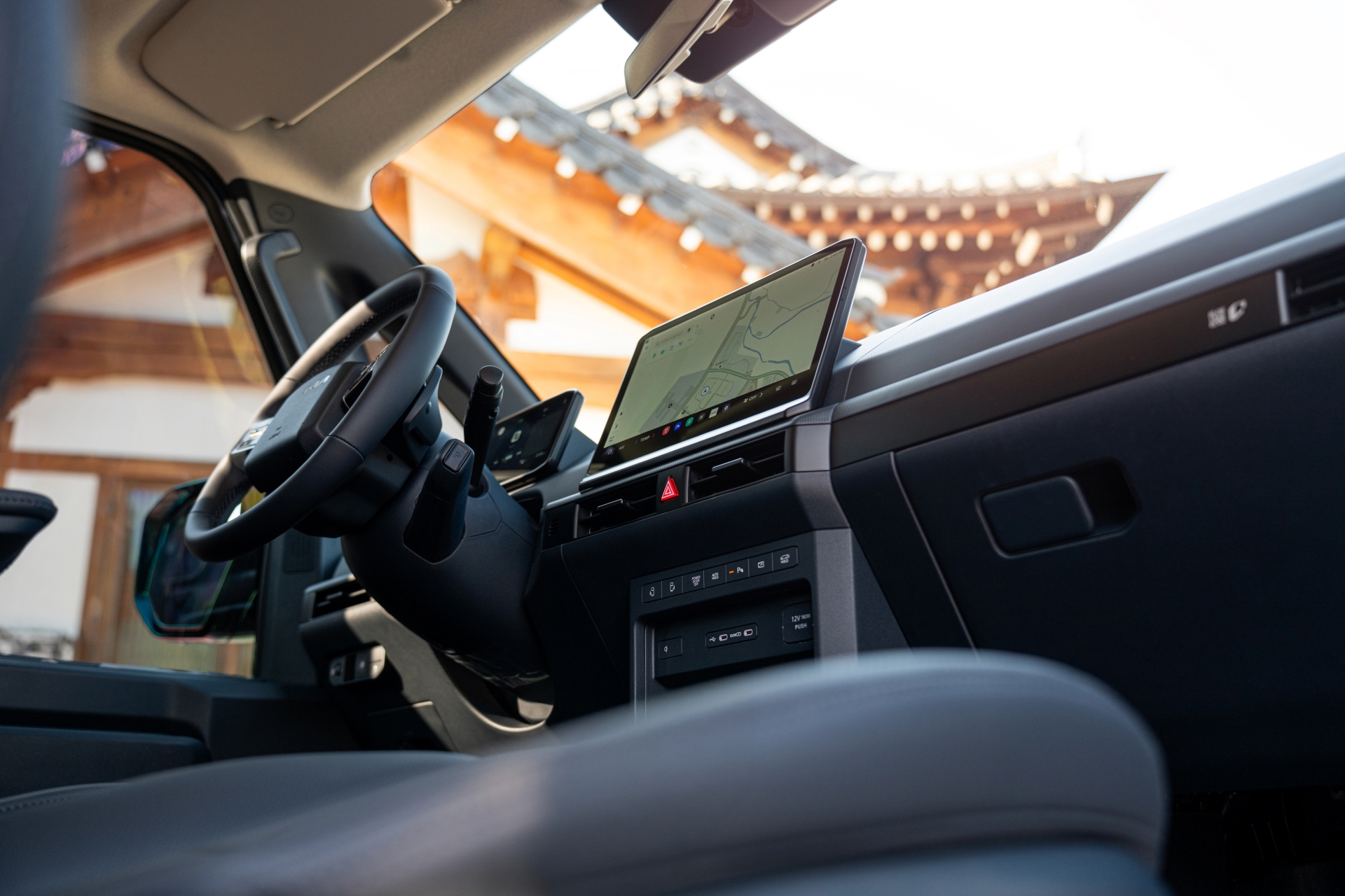 The Kia PV5 brings a sense of ease to quiet autumn paths, framed by warm, shifting colors.