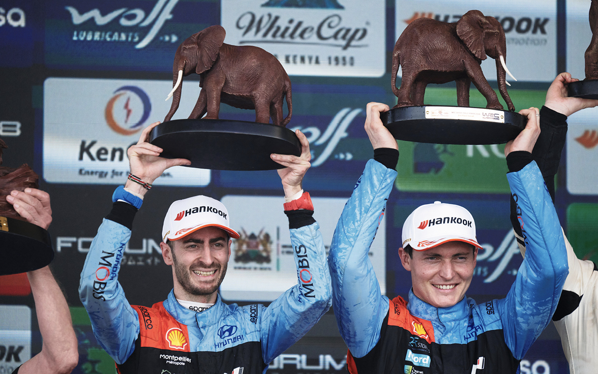 Adrian fourmaux delighted with the trophy with his co-driver