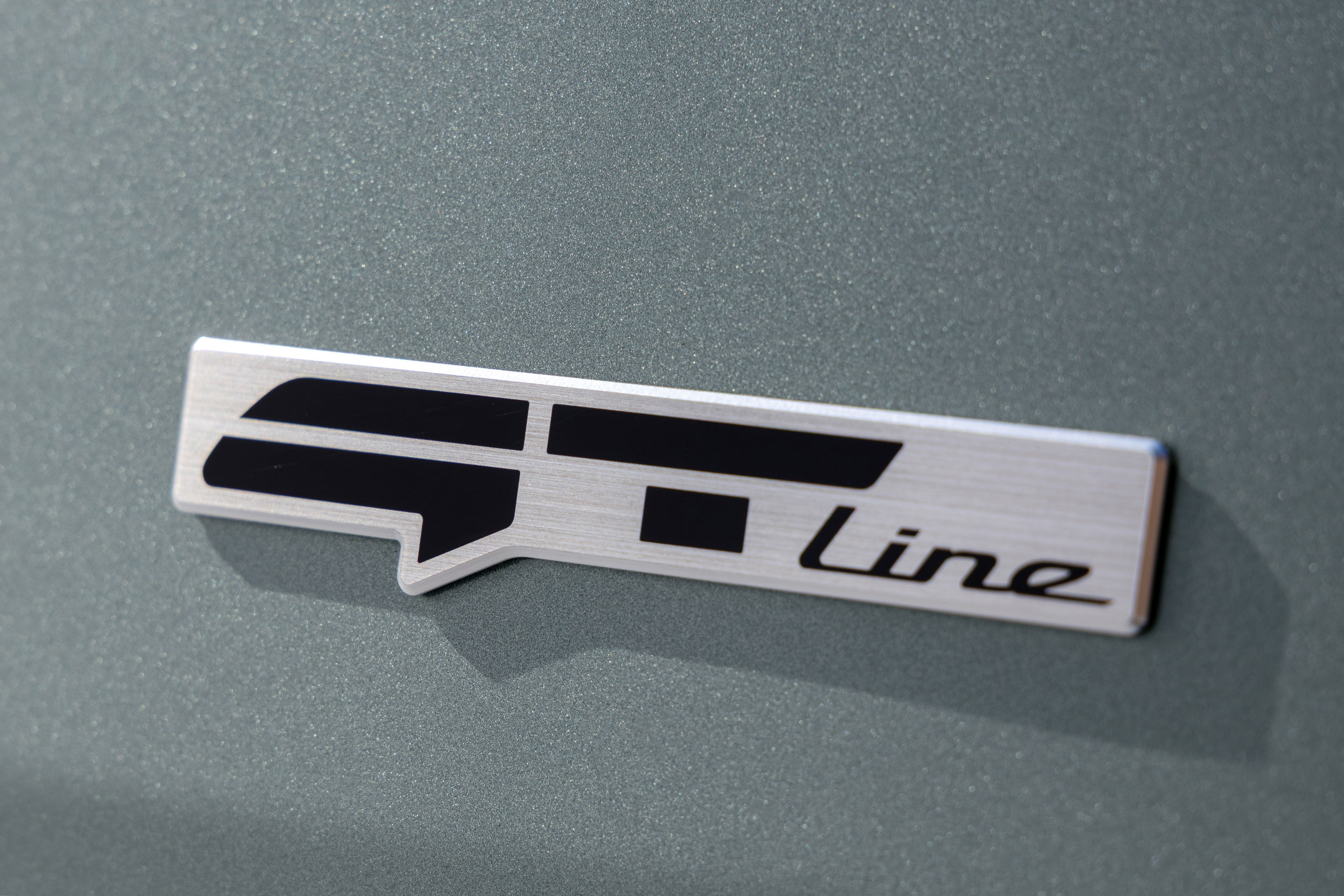 Set against rugged terrain, the Kia EV5 GT-Line stands out with distinctive details and proportions (12)