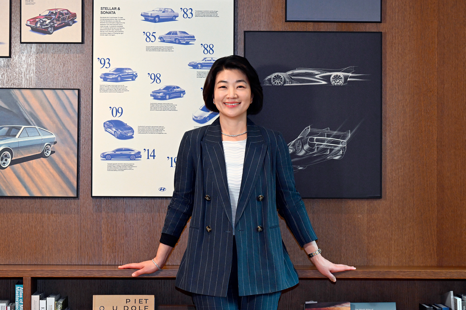 Hae In Kim, HMG CHRO at Hyundai Motor Group, posing in front of a framed artwork