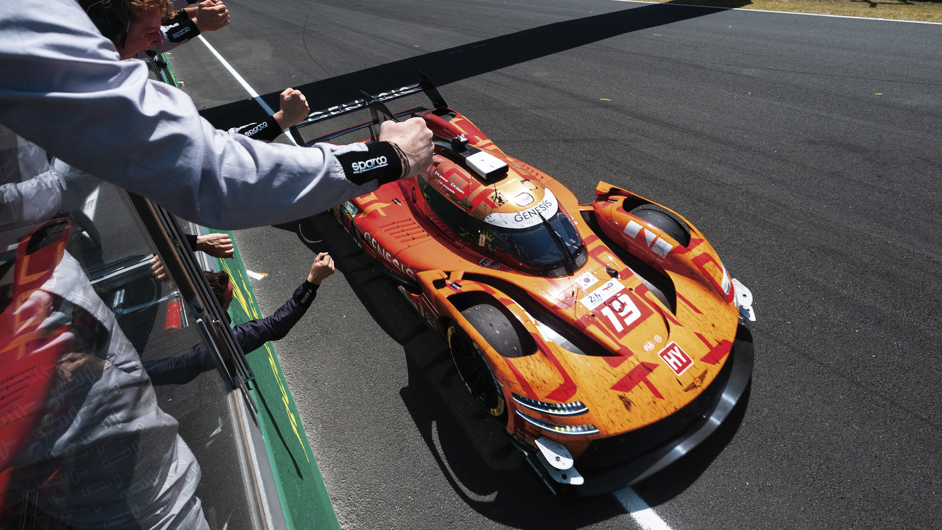 Genesis hypercar receiving the checkered flag at the 24 Hours of Le Mans