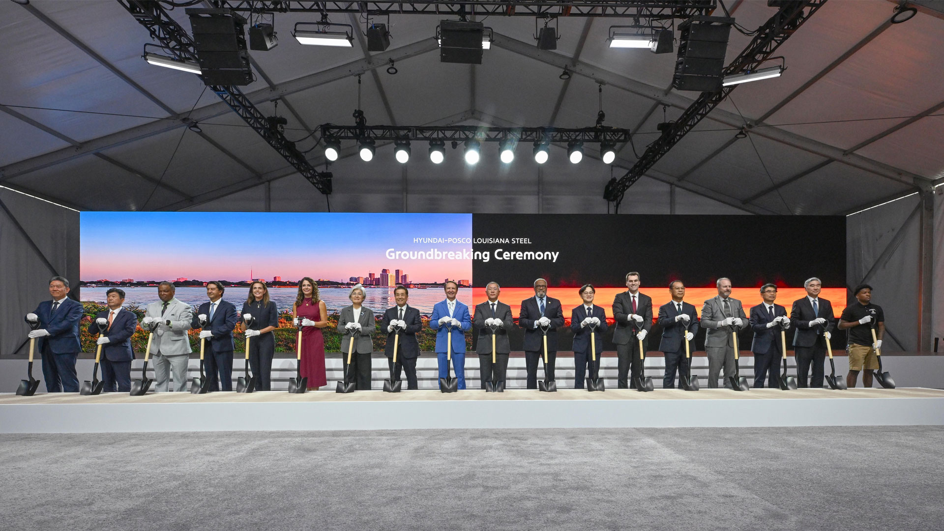 Key attendees who took part in the groundbreaking ceremony to mark the start of factory construction pose for a commemorative photo. From left: Hyundai Motor Group President Gang-hyeon Seo; POSCO Vice President Gwang-mu Kim; Donaldsonville Mayor Leroy Sullivan; Hyundai Motor Company President José Muñoz; Louisiana Secretary of Economic Development Susan Bourgeois; U.S. Representative Julia Letlow; Republic of Korea Ambassador to the United States Kyung-wha Kang; POSCO Group Chairman In-hwa Jang; Louisiana Governor Jeff Landry; Hyundai Motor Group Executive Chair Euisun Chung; U.S. Representative Troy Carter; Minister of Trade, Industry and Energy Jeong-kwan Kim; William Kimmitt, Deputy Under Secretary of Commerce for International Trade; Hyundai Steel President Bo-ryong Lee; Ascension Parish President Clint Cointment; Kia President Ho-sung Song; Hyundai Motor Group President Sung Kim; and River Parishes Community College (RPCC) student Cortaz Johnson.
